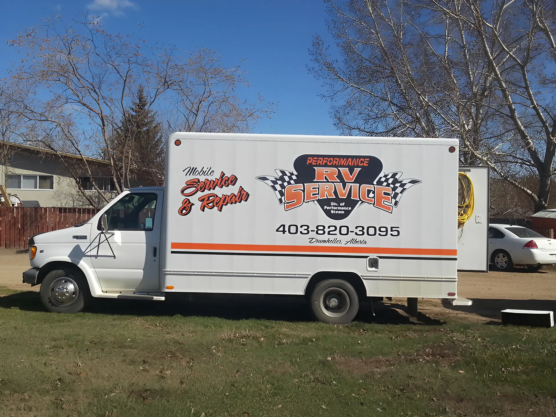 White RV service truck parked outside