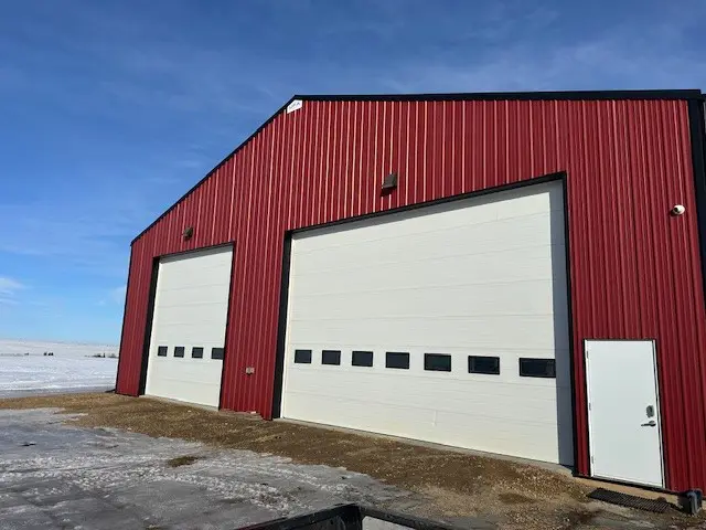 Red industrial building with large doors