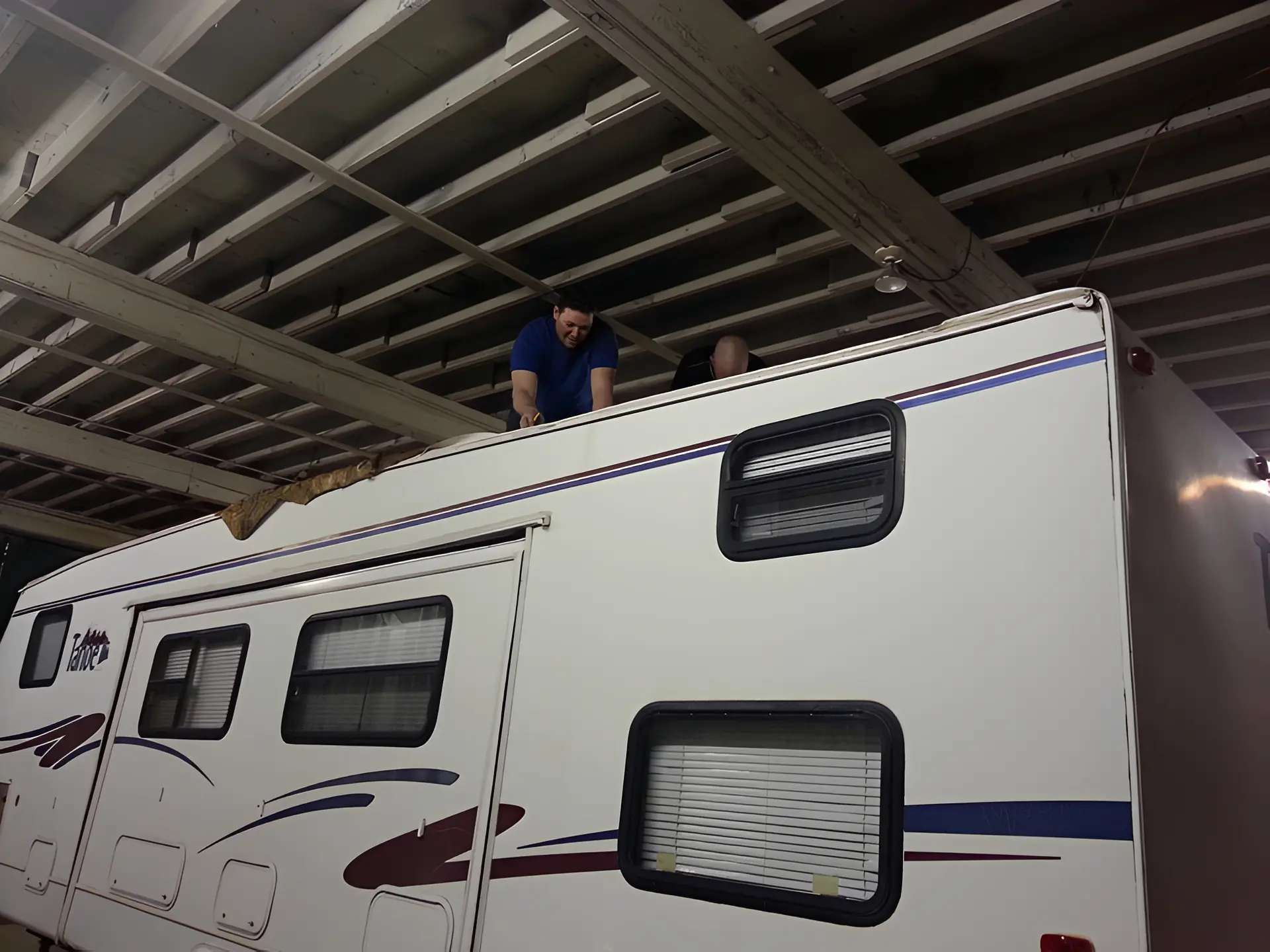 Maintenance on recreational vehicle under ceiling